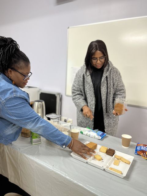 Church members serving tea and coffee after a service
